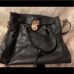 Michael Kora authentic gold and black purse